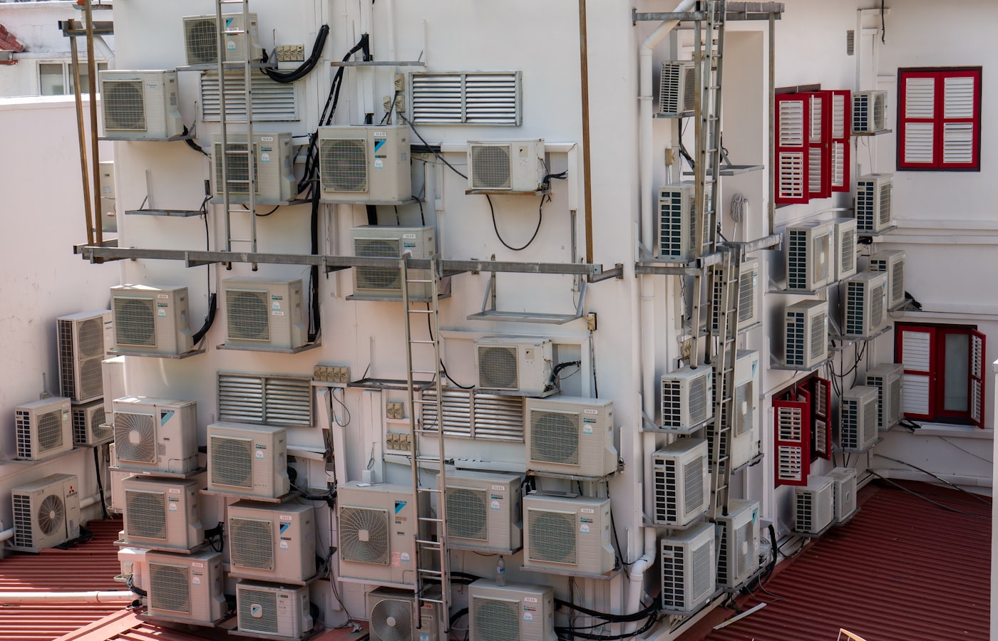 A bank of HVAC condenser units under a maintenance contract